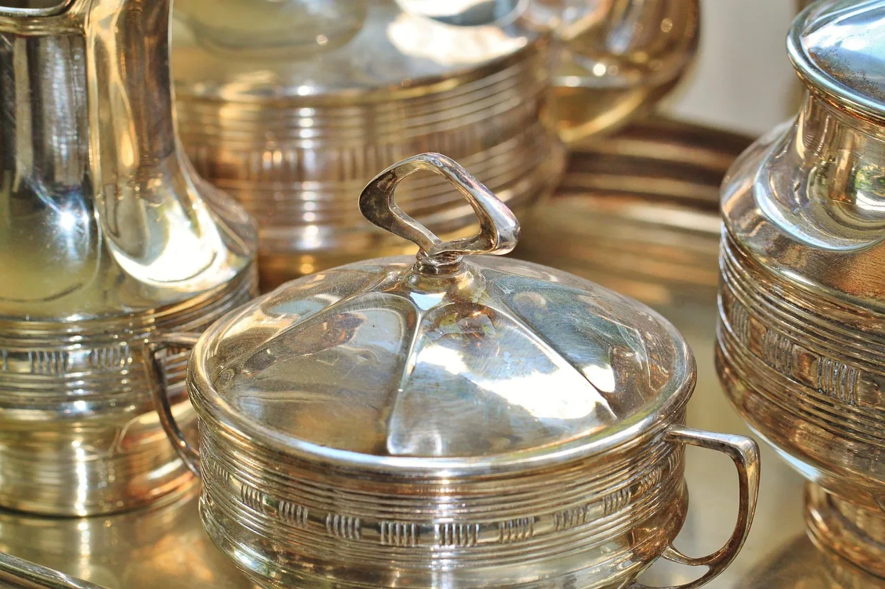 silverware, silver, sugar bowl, can, silver jug, art deco, coffee dishes, coffee setting, metal, table cover, cover, table, tea service, coffee service, detail shot, polished, glittering, nostalgia, antiquity, antique, old, art nouveau, silverware, silverware, silverware, silverware, silverware, silver, antique, antique, antique, art nouveau, art nouveau, art nouveau. Identify inherited silver object: mark to material