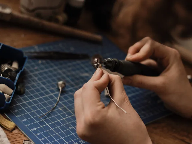 Artisan polishing silver jewelry with precision in a workshop setting. Workshop exposure controls compared for silver work