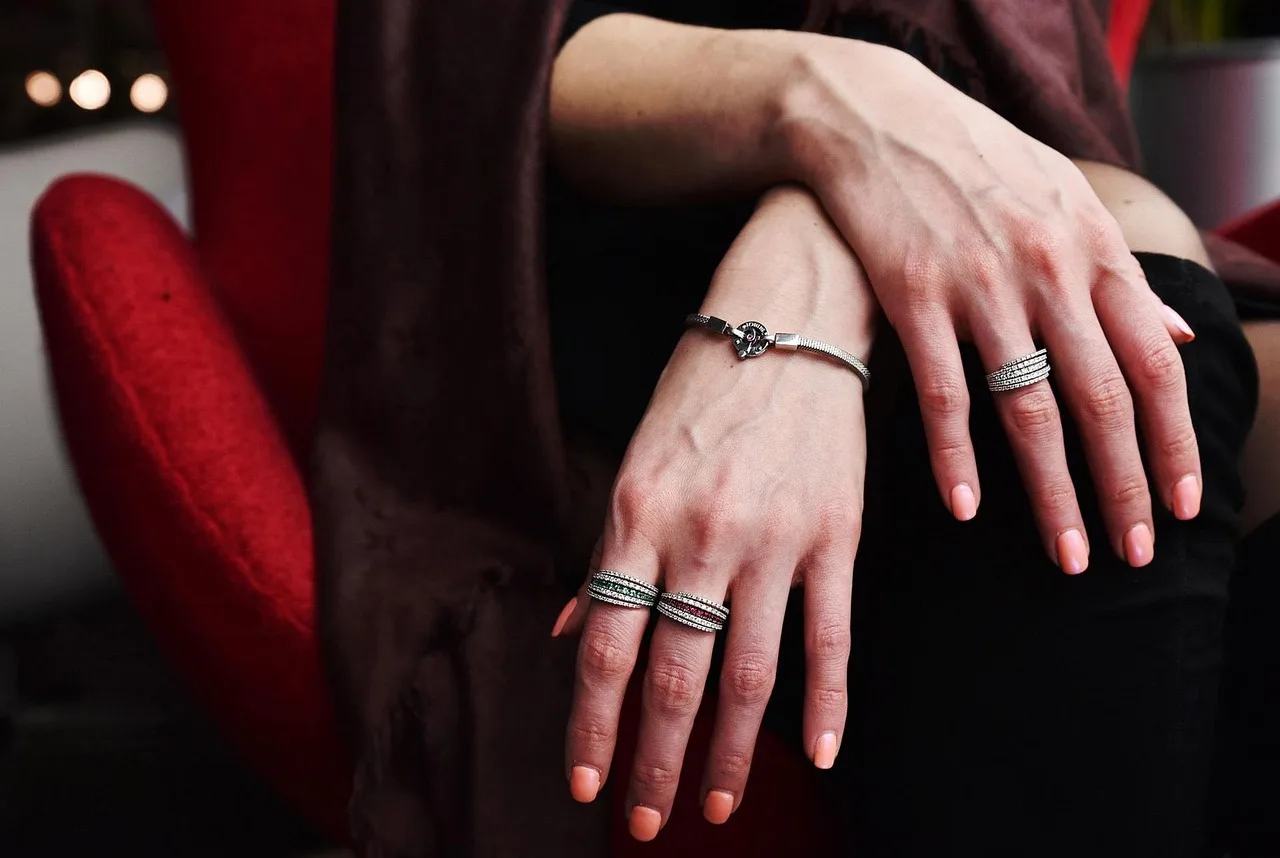 ring, diamond, ruby, emerald, bracelet, sterling silver jewelry, female hands, silver, jewel, ruby, emerald, emerald, emerald, emerald, emerald, bracelet, bracelet, bracelet, bracelet, bracelet. Repair Misaligned Stamped Silver Border: Fictional Scenario